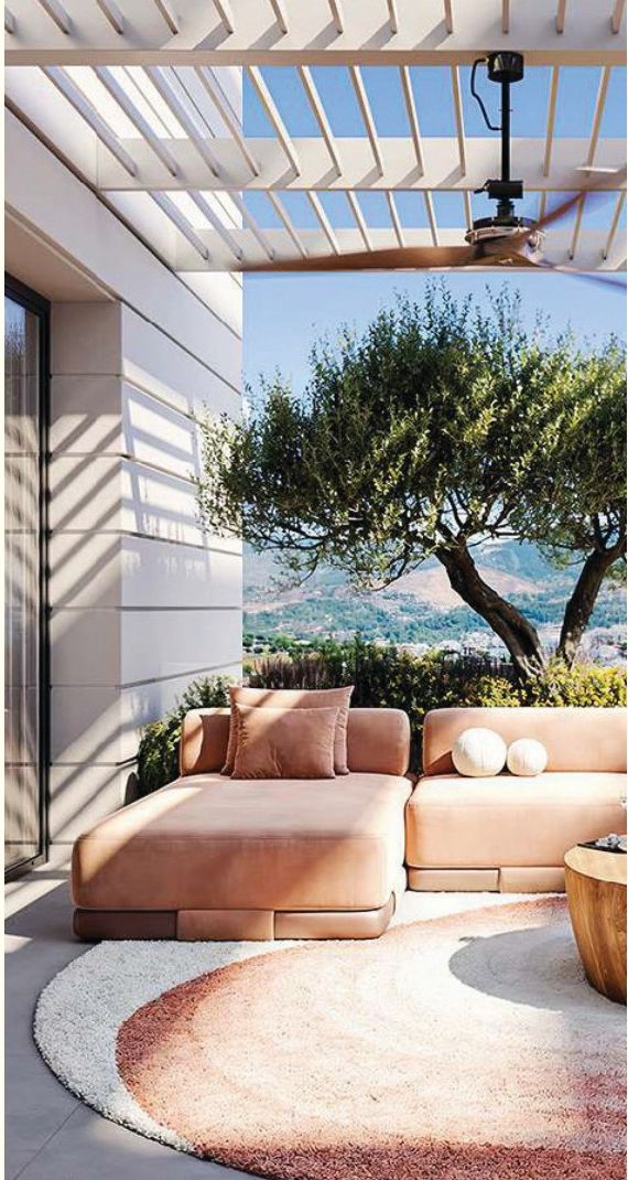 Outdoor balcony at Eden with olive tree and mountain views